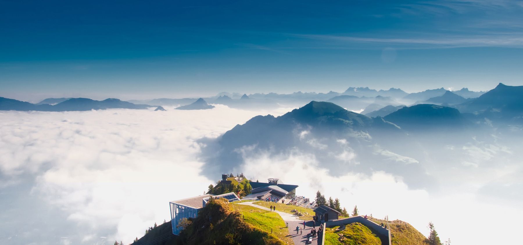 Mountain peaks rising above the clouds